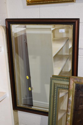 Lot 274 - Modern bevelled wall mirror in dark finish frame