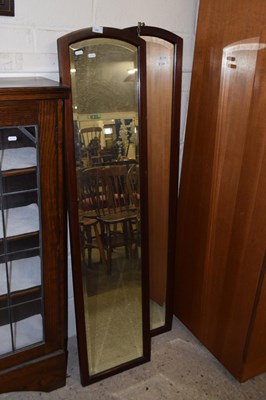 Lot 289 - A pair of narrow bevelled wall mirrors in...
