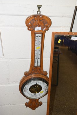 Lot 302 - A late 19th Century oak framed barometer and...