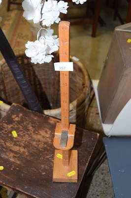 Lot 357 - A wooden measuring gauge