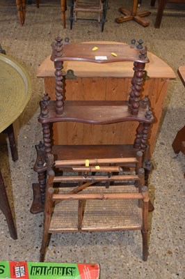 Lot 377 - A bamboo framed magazine rack and a three tier...