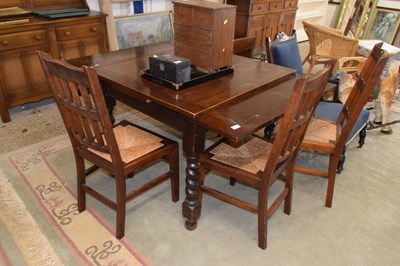 Lot 386 - An oak barley twist drawer leaf dining table