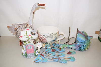 Lot 550 - Two metal model birds, oversized teacup...