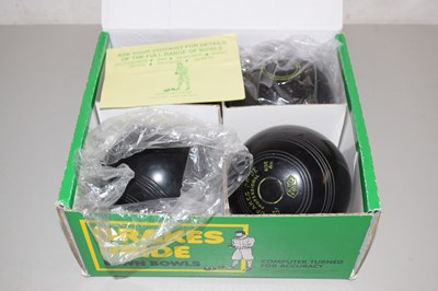 Lot 555 - Set of four Drakes Pride lawn bowls