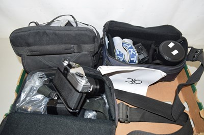 Lot 616 - An Olympus OM10 camera together with a Canon...