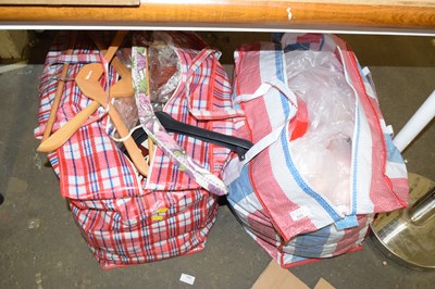 Lot 695 - Two bags of clothes hangers and other items