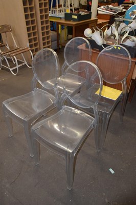 Lot 751 - A set of four clear perspex ghost chairs