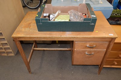 Lot 779 - A light wood office desk
