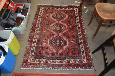 Lot 787 - A Middle Eastern red ground floor rug