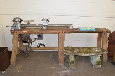 Lot 829 - A large vintage lathe on wooden stand