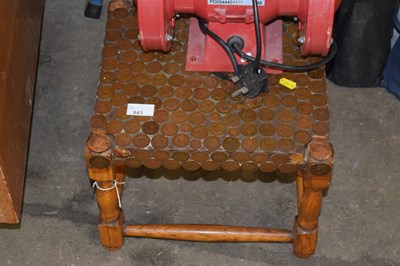 Lot 843 - A small stool covered in half penny coins