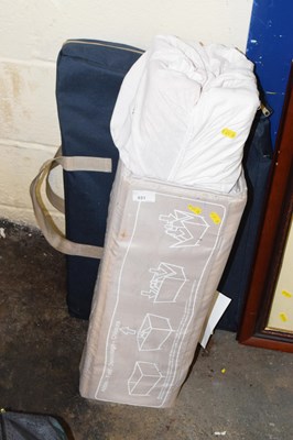 Lot 851 - A folding play pen and one other