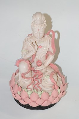 Lot 214 - An Oriental porcelain model of Guanyin...