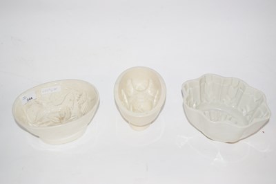 Lot 244 - A group of three ceramic jelly moulds...