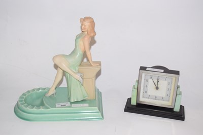 Lot 266 - An Art Deco alarm clock by Temco together with...