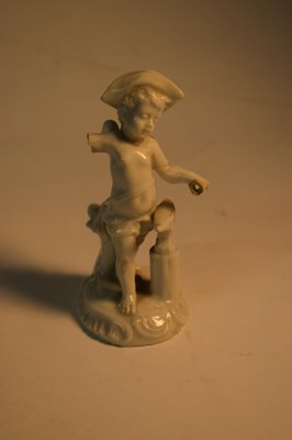 Lot 274 - A small blanc de chine model of a putto at...
