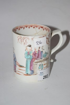 Lot 282 - A Lowestoft polychrome mug painted with...