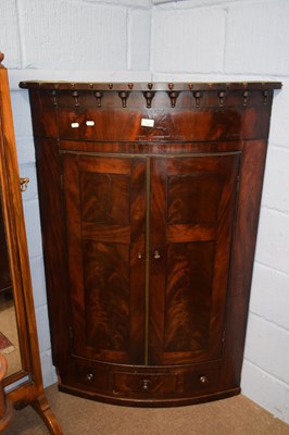 Lot 362 - A late Georgian mahogany bow front corner...