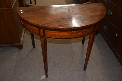 Lot 385 - A Georgian mahogany demi lune tea table with...