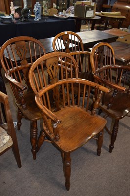Lot 391 - A set of four elm and yew wood Windsor style...