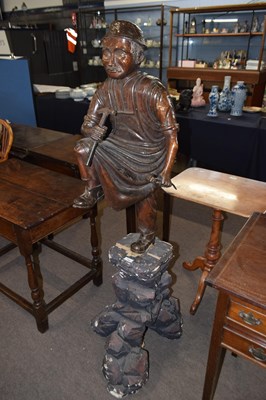 Lot 393 - A Chinese lacquered wood figure of a cobbler...