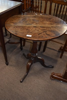 Lot 396 - An oak wine table with circular top raised on...