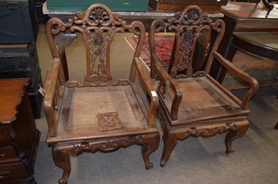 Lot 400 - A pair of Chinese hardwood armchairs with...