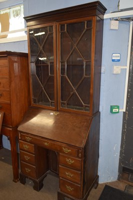 Lot 477 - A Georgian mahogany bureau bookcase, the top...
