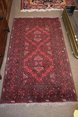 Lot 493 - 20th Century Afghan rug decorated with a...