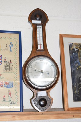 Lot 31 - An early 20th Century hardwood framed barometer