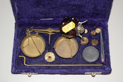 Lot 127 - Small brass beam scales and a ladybird clock