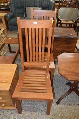 Lot 330 - A pair of modern hardwood dining chairs with...