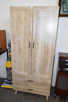 Lot 738 - A light wood effect wardrobe